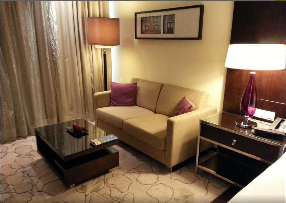Jaipur Marriott Hotel Exterior photo A sofa in a hotel room